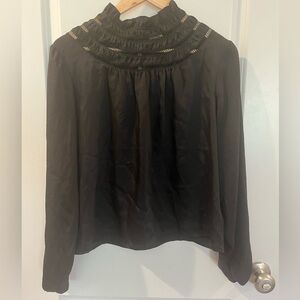 Express Black Shirt with High Neck
And Gathered at Wrist.